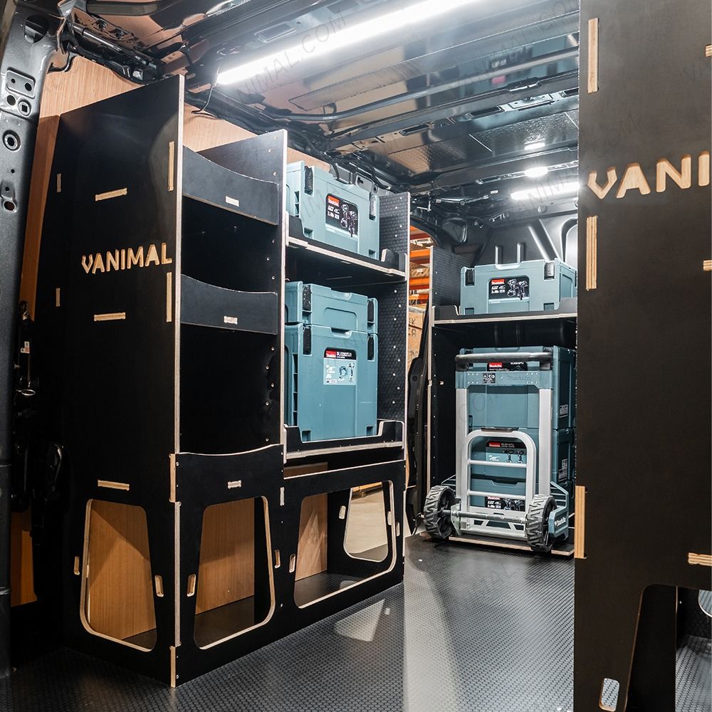 Rear van NS angle view of the Kia PV5 Cargo Makita Makpac Trolley Compatible Van Racking (x3 V1) displayed with Milwaukee toolboxes and trolley