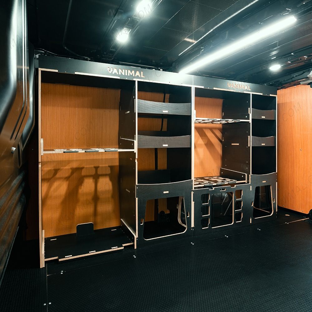 Side van  angle view of the Kia PV5 Cargo Milwaukee Packout Trolley Compatible Van Racking (Full OS) displayed with top trays