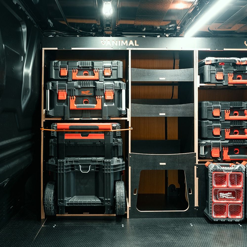 Side van view of the OS side of the Toyota Proace 2016+ L1 Milwaukee Packout Trolley Compatible Van Racking displayed with Milwaukee toolboxes and trolley