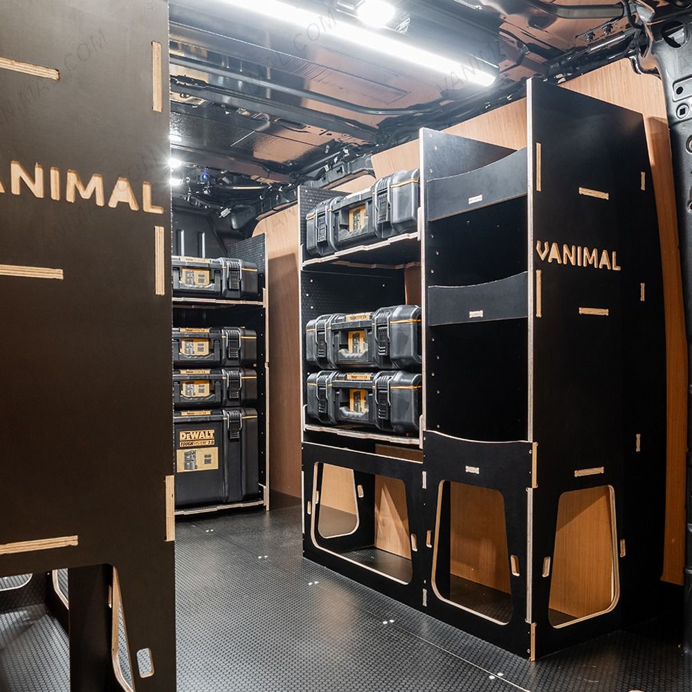 Rear van OS angle view of the Kia PV5 Cargo DeWalt ToughSystem Trolley Compatible Van Racking (x3 V1) displayed with DeWalt ToughSystem toolboxes and trolley