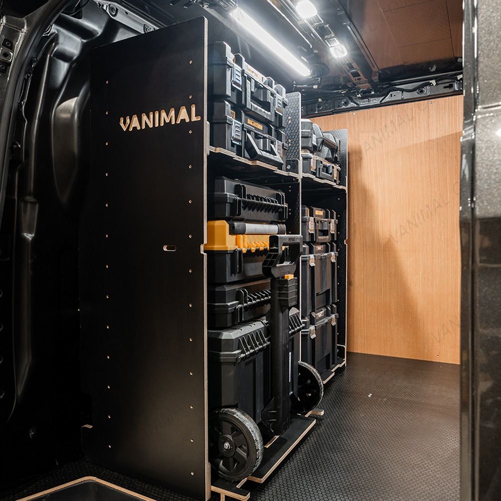 Side van view of the bulkhead section of the Kia PV5 Cargo 2025- DeWalt TSTAK Trolley Compatible Van Racking (x3 V1) displayed with DeWalt TSTAK toolboxes