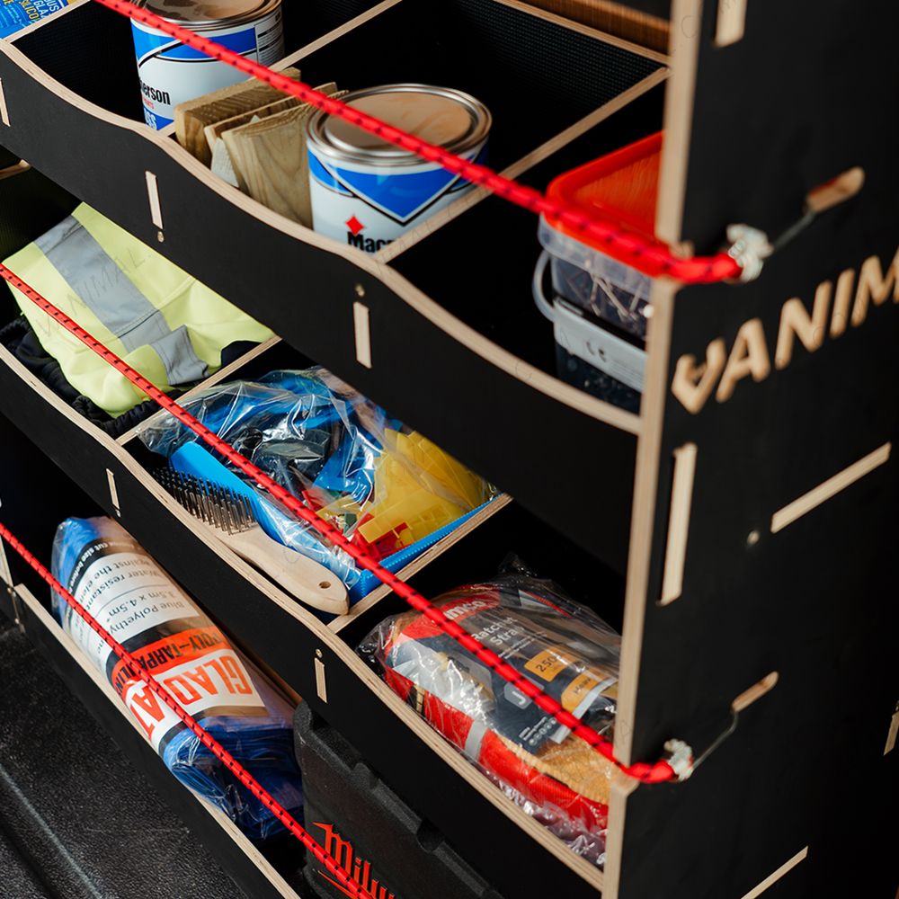 Close-up view of the racking compartments displaying equipment, tools and boxes 