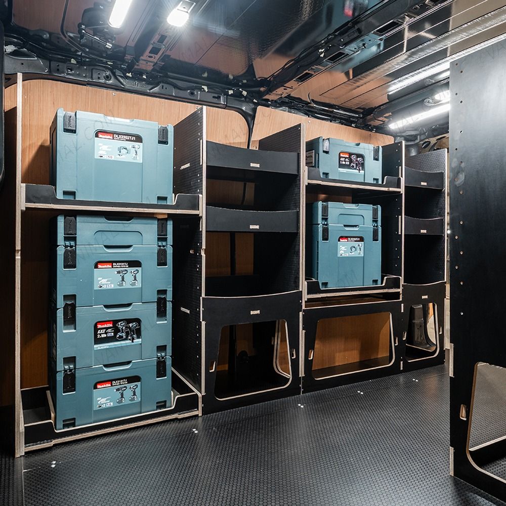 Side van angle view of the Kia PV5 Cargo Makita Makpac Toolbox Compatible Van Racking (x3 V2) displayed with Makita toolboxes