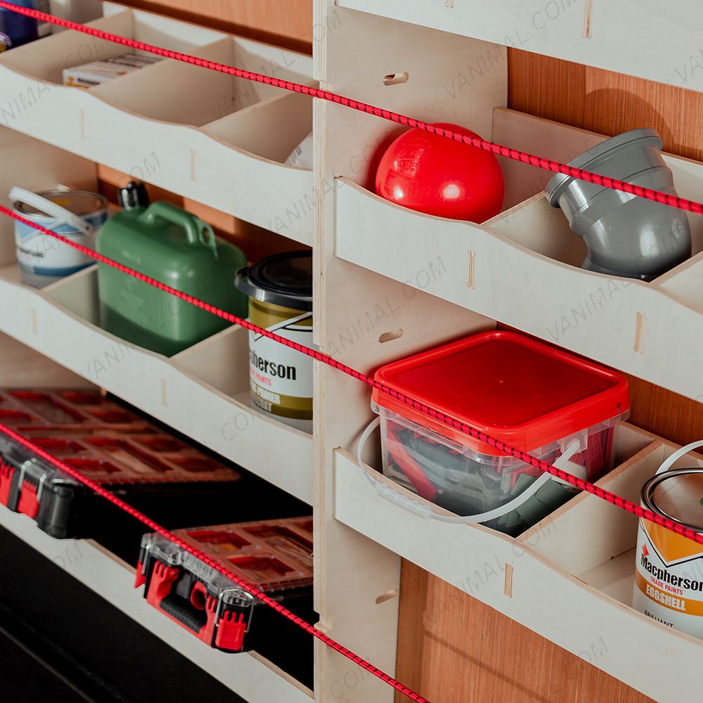 Close-up view of the OS side racking compartments and toolbox shelf